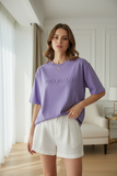Purple t-shirt with 'PAS JALOU' text on a white background