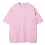 Pink t-shirt with 'PAS JALOU' text on a white background