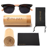 Eco-friendly wooden sunglasses displayed next to a bamboo case