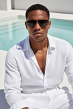 Man wearing Pas Jalou sunglasses and a white outfit by a pool