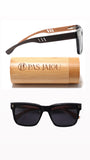 Earth-friendly wooden sunglasses with stylish bamboo case displayed on a table