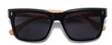 Earth-friendly wooden sunglasses with stylish bamboo case displayed on a table