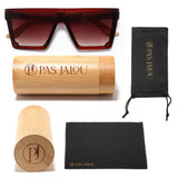 UV400 protective wooden sunglasses resting beside a sustainable bamboo case