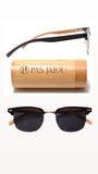 Eco-friendly wooden sunglasses displayed next to a bamboo case