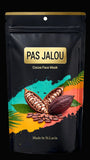 Pas Jalou cocoa face mask packaging with cacao beans and leaves on a colorful background