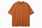 Brown t-shirt with 'PAS JALOU' embossed text