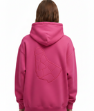 Person wearing a rose pink hoodie with a geometric embossed design of the map of barbados on the back of the sweater